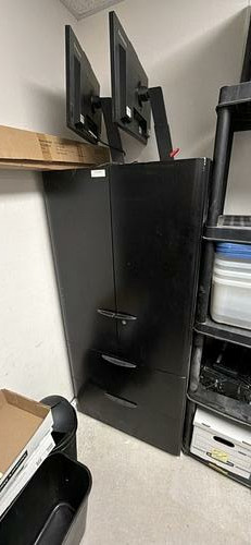 Tall dark office supply cabinet