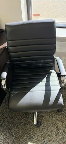 Black ribbed-back office chairs