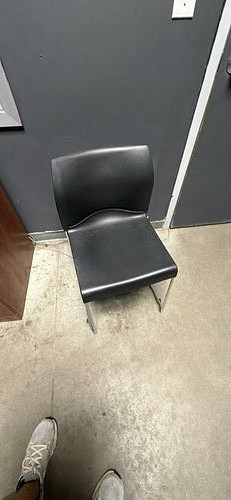 Black molded plastic chairs