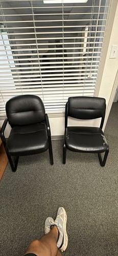 Black padded guest chairs — pair