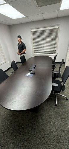 Dark oval conference table