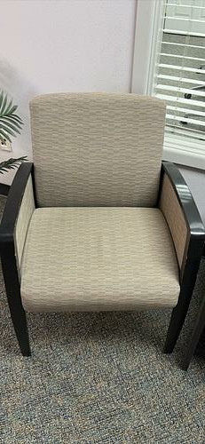 Gray upholstered guest chair