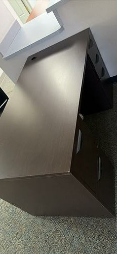 Dark five-drawer office desk