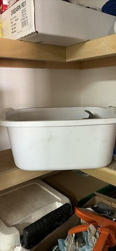 Light-colored plastic storage bin