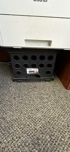 Black plastic storage crate
