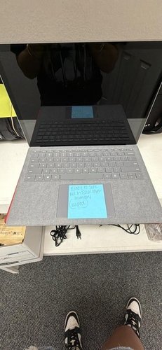 Microsoft Surface model 1950 with charger