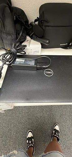 Dell Latitude 3500 laptop with charger